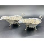 A pair of silver sauce boats hallmarked Sheffield 1919 by James Deakin & Sons