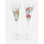 Two tall decorative glass flutes