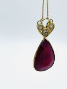 Ruby and three diamond pendant on fine 9ct chain.