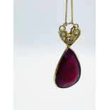 Ruby and three diamond pendant on fine 9ct chain.