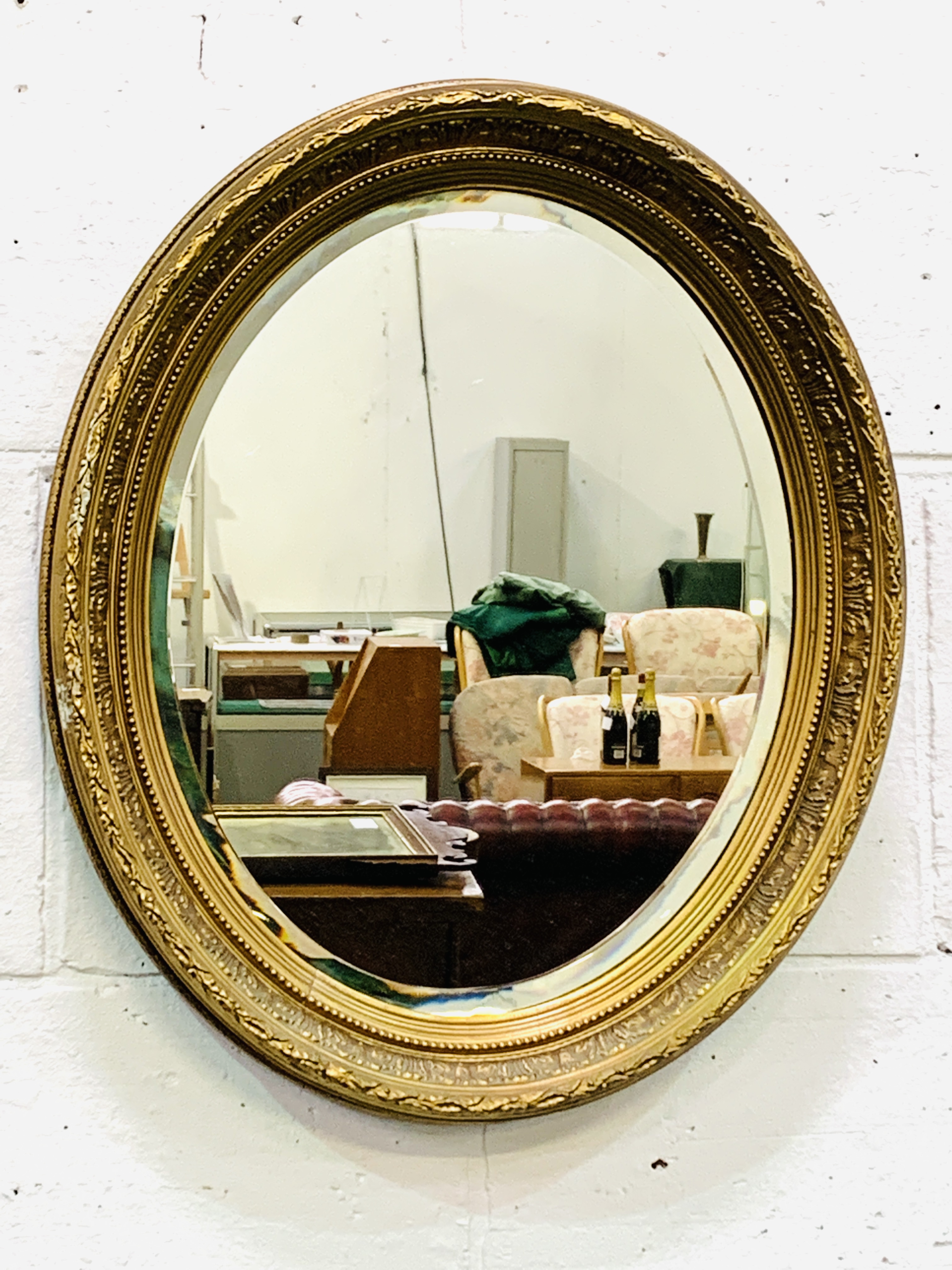 Oval gilt decorative edge wall mirror