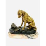 Brass/bronze figure of a dog sitting over a cat eating from a dish, signed A de Gericke