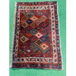 Hand-knotted red and blue prayer mat