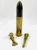 Brass dogs' head nut crackers, horse's head door knocker, shell and shell case