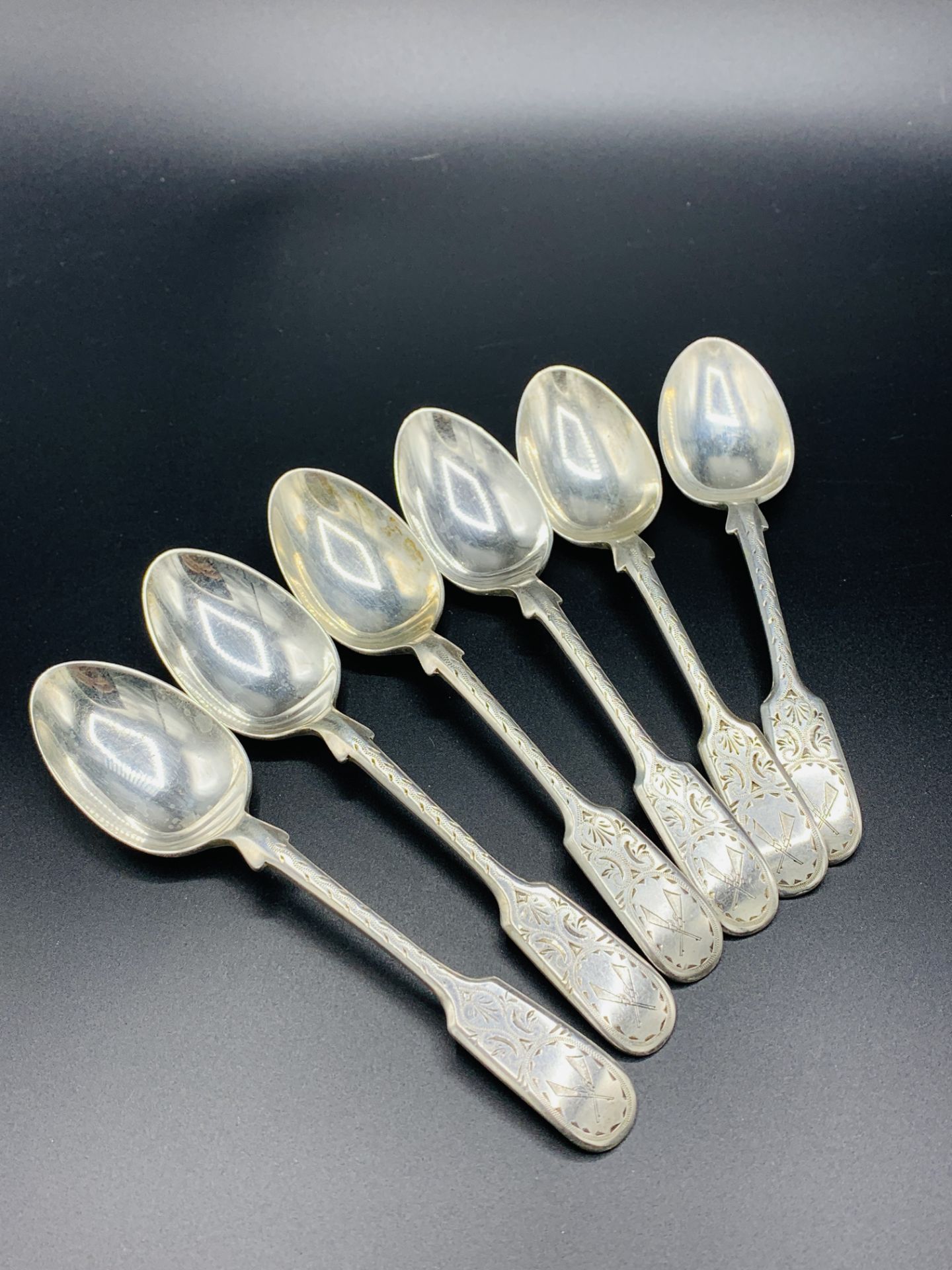 Six silver teaspoons with engraved decoration and crossed rifles to handles - Image 3 of 3