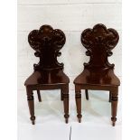 Two mahogany hall chairs with shaped backs