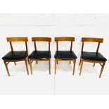 Four teak framed curved back dining chairs
