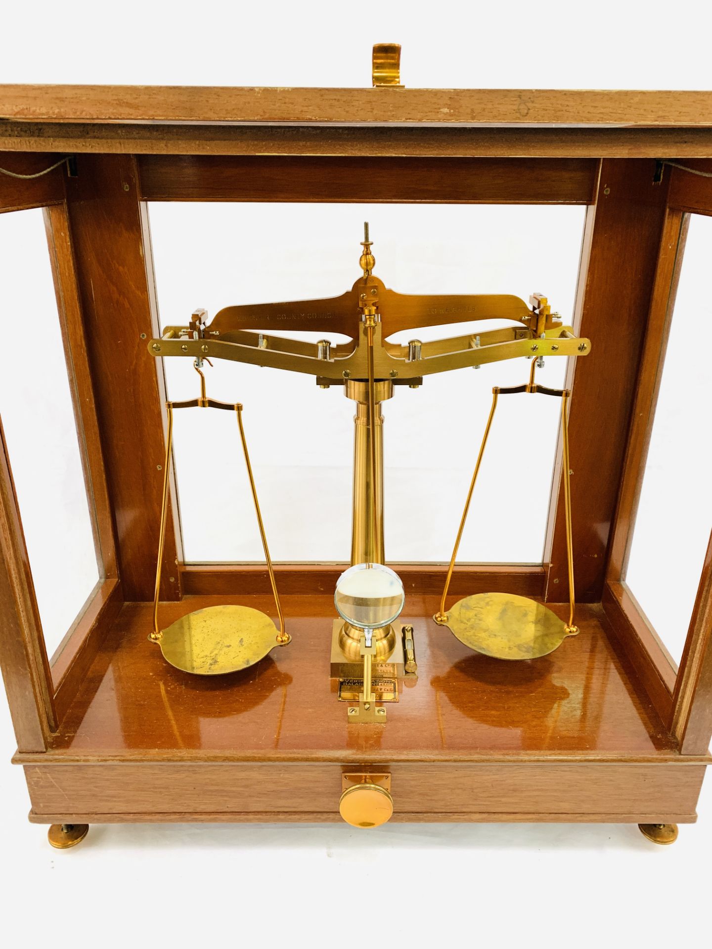 A set of brass balance scales to test 1lb by De Grave, Short and Co Ltd, London,