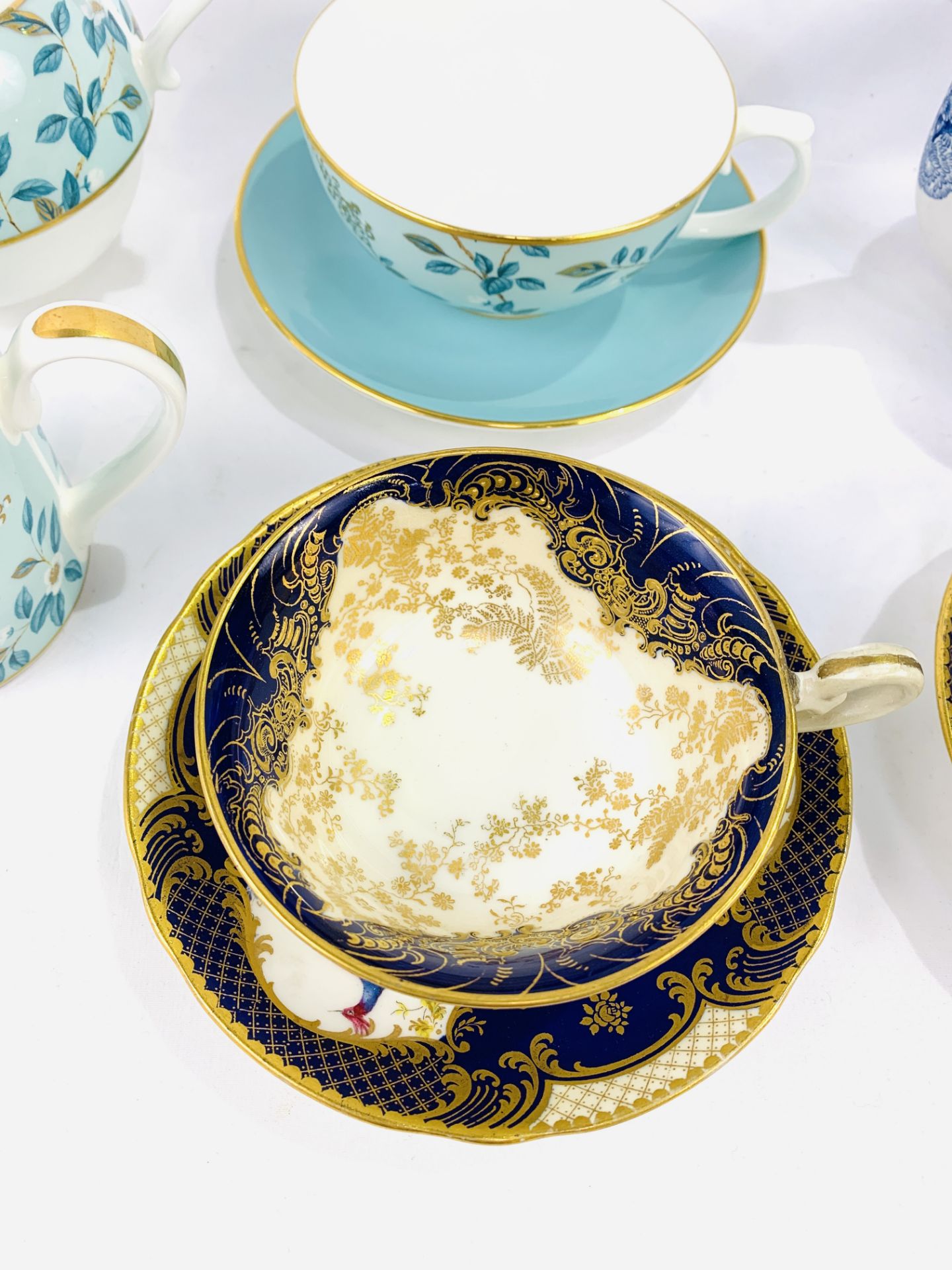 Two Royal Doulton blue and gilt decorated cups and saucers signed E Percy - Image 3 of 6