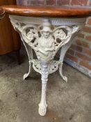 Pair of Victorian decorative white painted cast iron tables by Gaskells Barfitters Ltd of Cardiff
