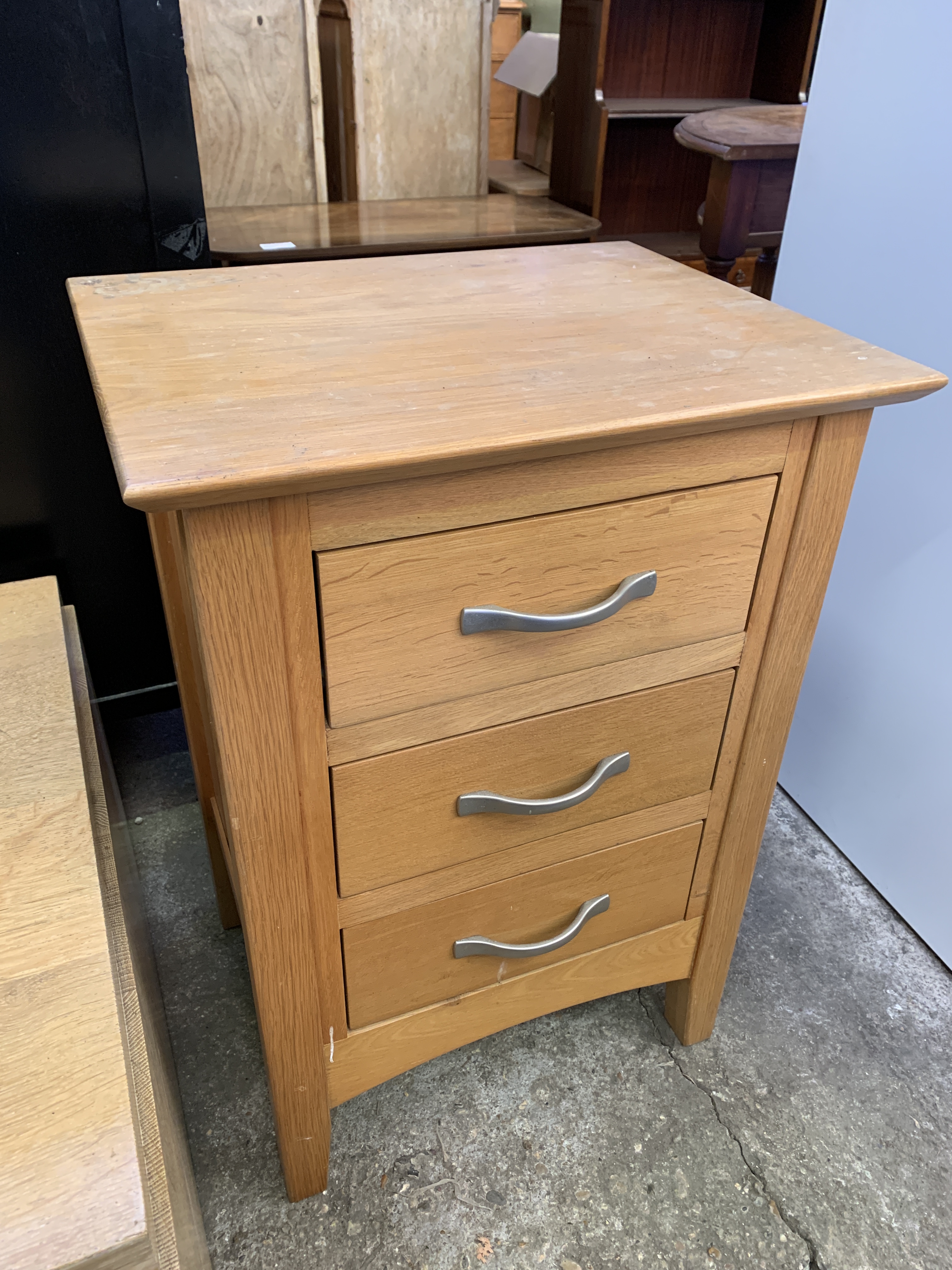 Contemporary low table and a three drawer bedside cabinet