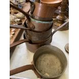 Eight antique copper pans