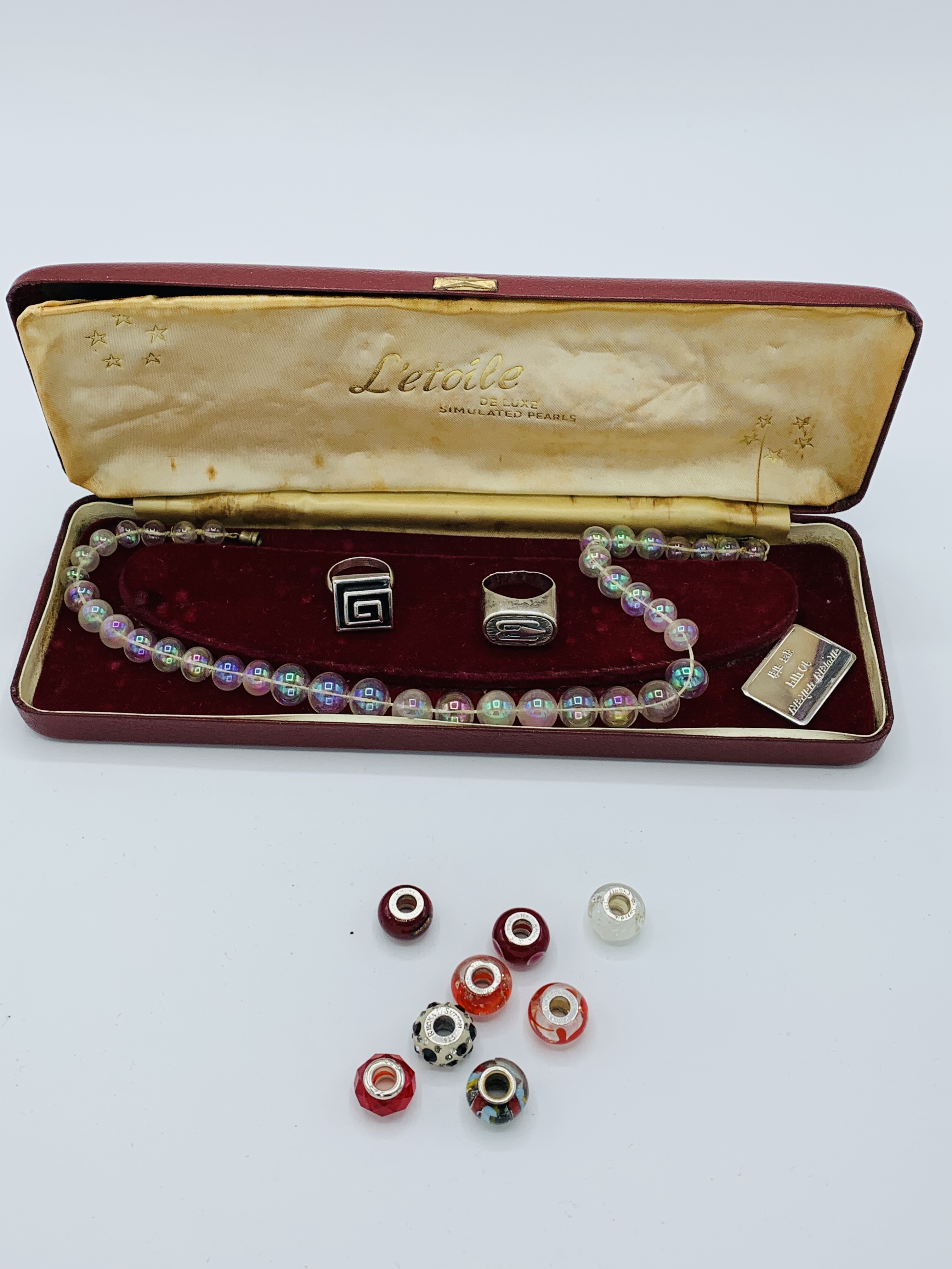 An antique necklace of blown glass beads and other items