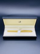 New Dunhill gold coloured fountain pen, with a 14ct gold nib