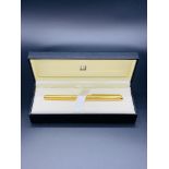 New Dunhill gold coloured fountain pen, with a 14ct gold nib