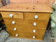 Pine chest of two over three drawers with white ceramic handles