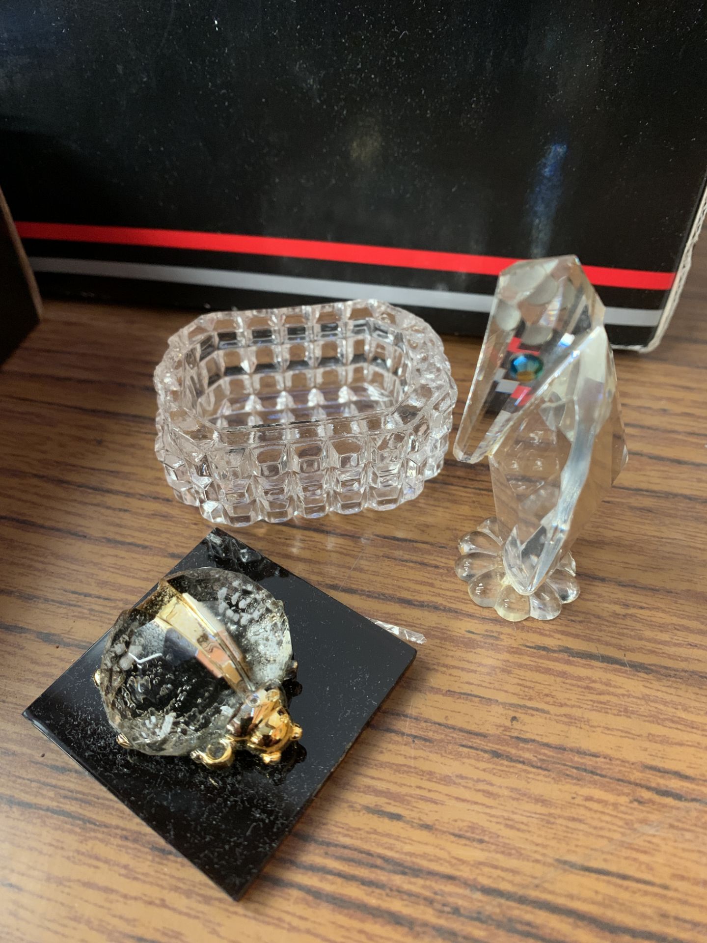 Two small cabinets of crystal glass animals including Swarovski
