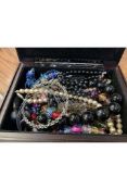 Jewellery box with photo frame in lid containing a quantity of costume jewellery.