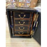Black leather bound small lockable cabinet