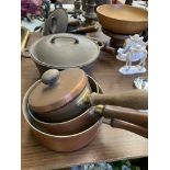 Various copper saucepans and other pans