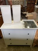 White chest of three drawers and a white painted three fold dressing table mirror