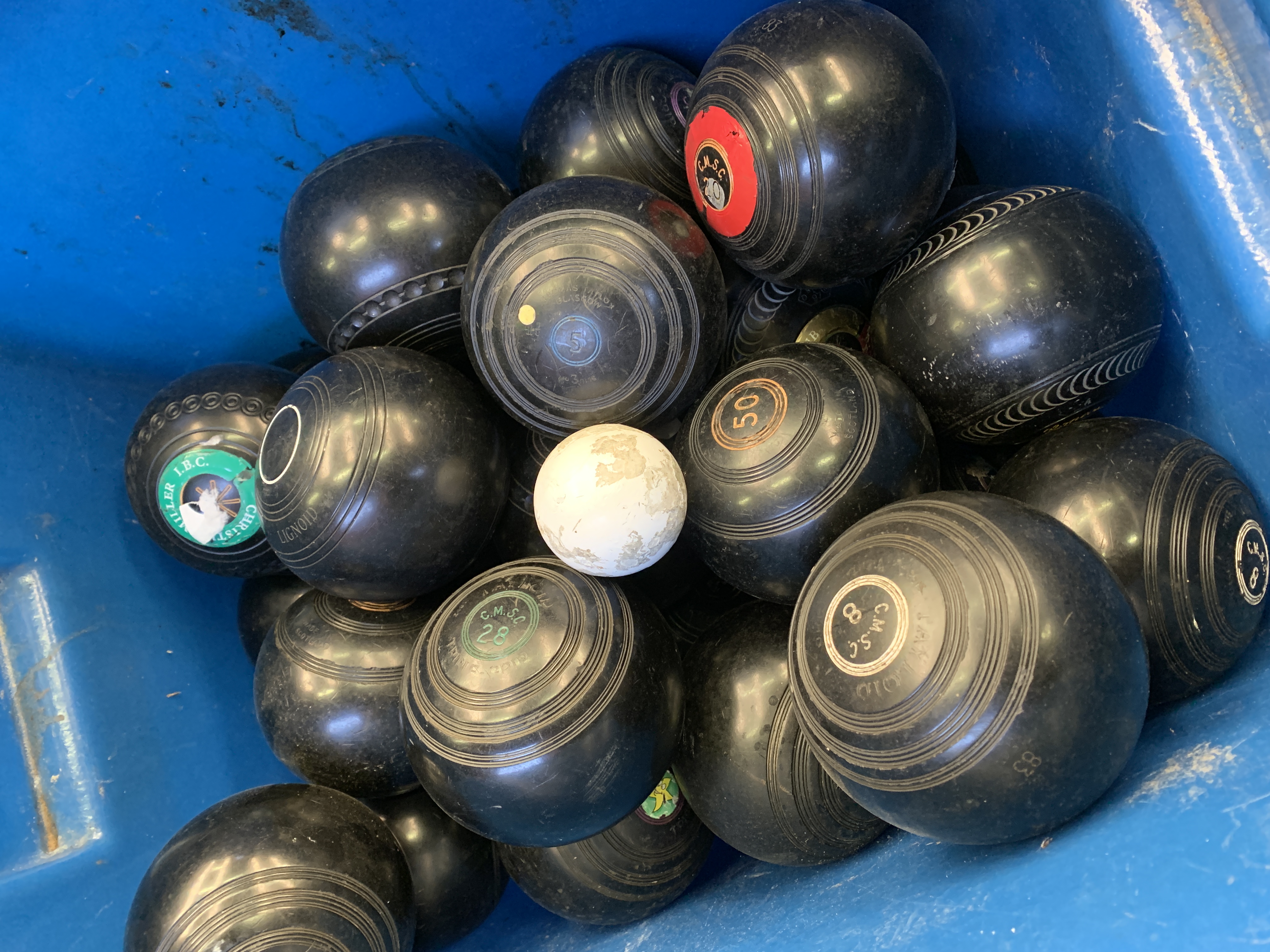 68 lawn bowls of various weights