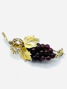 Silver gilt (marked 800) and garnet brooch in the form of a bunch of grapes