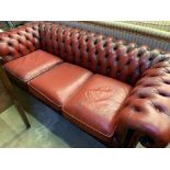 Red leather buttoned back Chesterfield