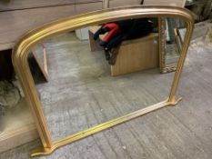 Gilt framed arch top over-mantel mirror