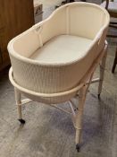 1930's cream painted plaited fibre crib on cane stand