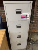 Four drawer metal filing cabinet with keys.