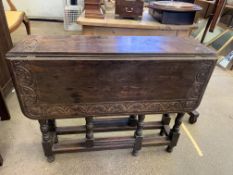 Oak drop side gate leg table, with carved top