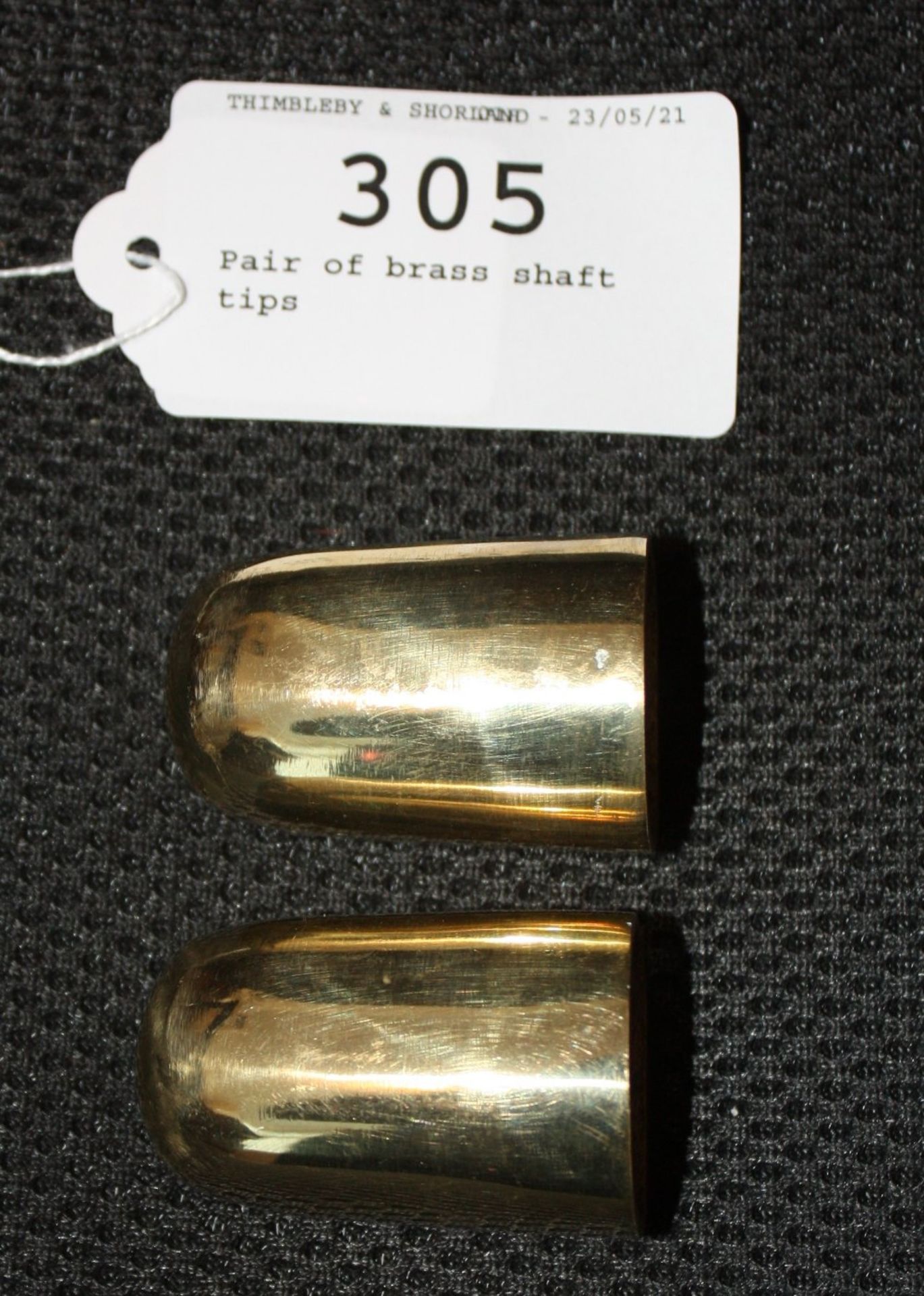Pair of brass shaft tips.