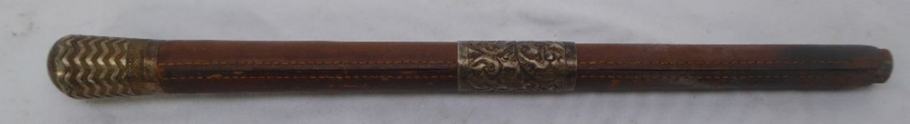 Leather handle for a driving whip, with collar and butt cap.