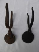 2 large rowelled spurs.
