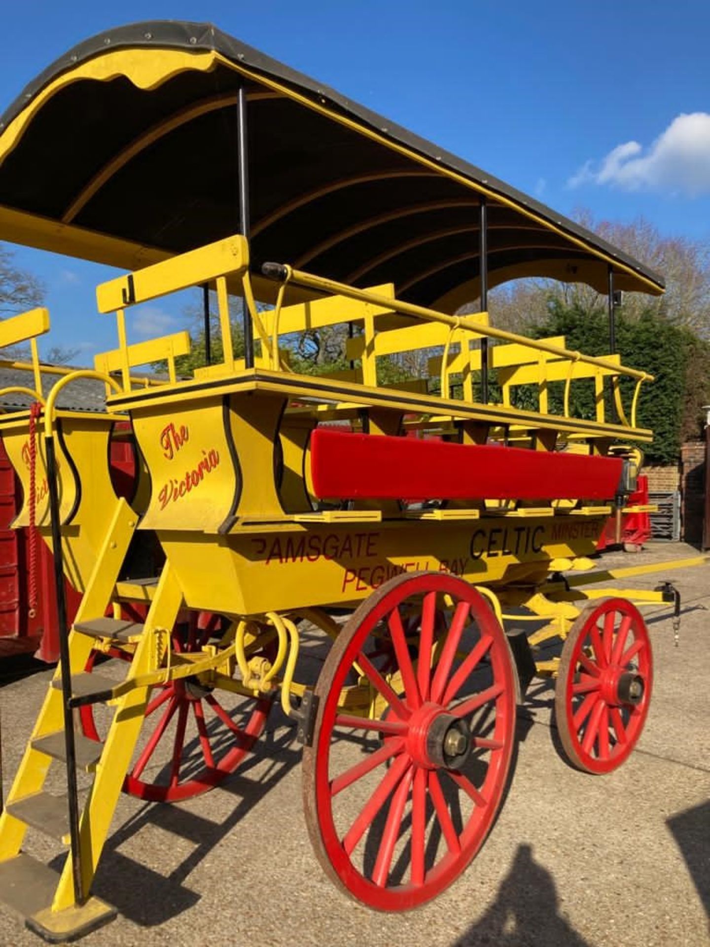CHARABANC painted yellow and red with 21 wooden seats accessible via a rear staircase - Image 4 of 5