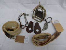 Selection of curb chains, stirrup irons, show and Lampwick girths.