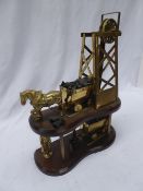 Brass model 2-storey mine shaft with a horse and coal wagon, and another beneath.