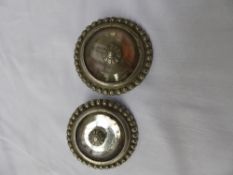 Pair of rare mirrored bridle rosettes.