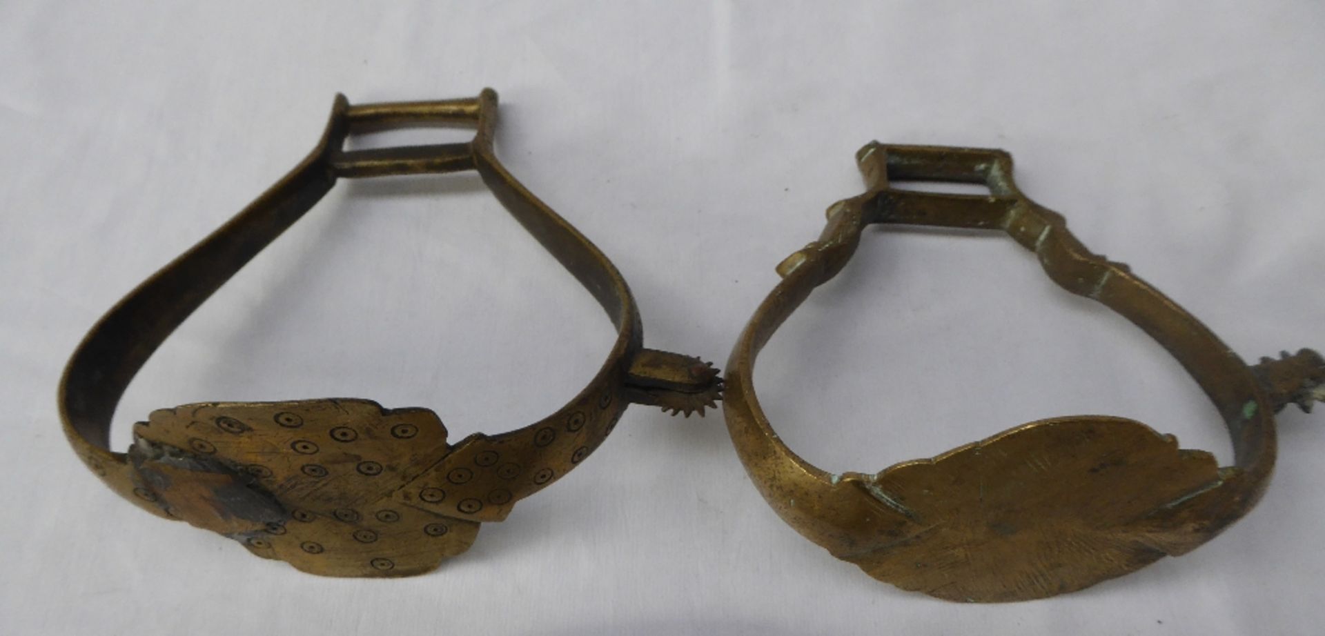 2 South American stirrups with rowelled spurs incorporated in the sides.