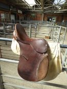 Brown leather 17.5ins English saddle with cover.