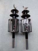 Pair of whitemetal lamps with eagle finials, approx. 23ins tall - carries VAT.