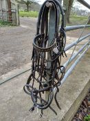 3 x bridles with no bits or reins and 1 x drop nose band.