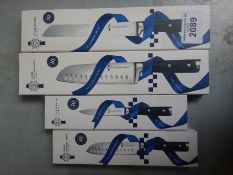 Four Le Cordon Bleu knives, small and large santoku, bread and utility.