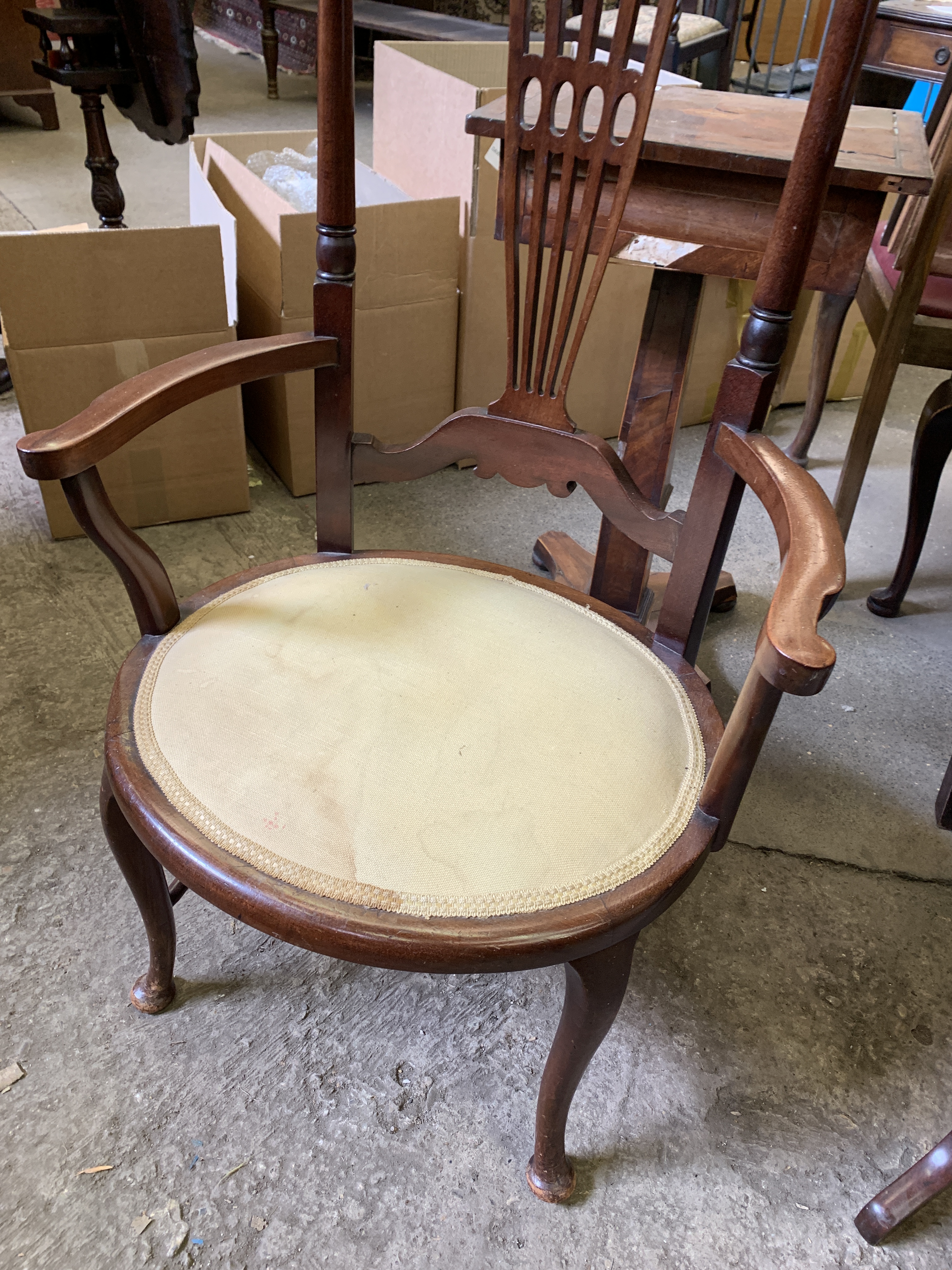 Mahogany framed high back low seat open elbow chair; together with a mahogany chair