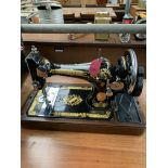 Manual Singer sewing machine in case