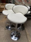 Three cream leather and chrome bar chairs