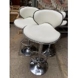 Three cream leather and chrome bar chairs