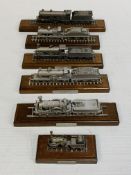 Six diecast model locomotives on wooden bases