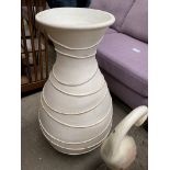 Cream painted urn shape vase and a carved wooden Heron figure